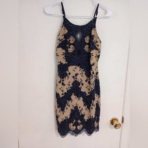 Storia Lace Dress- never worn without tags.  Blue/Cream with 3 cutouts on chest.